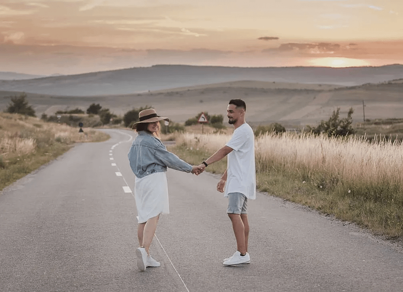 The example above is about humor, but who said that Midjourney is not capable of creating professional images? Look at the photo below: it was generated after combining two photographs (a young couple and a mountain landscape). Why not use it as a theme for the homepage of an online store of clothing or goods/services for travelers?